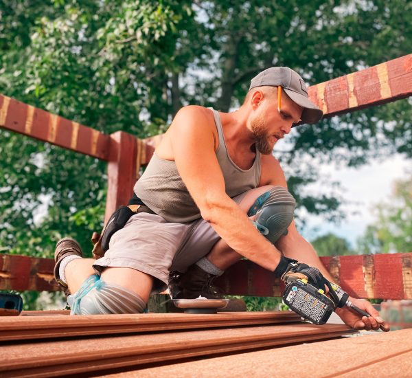 a-man-working-hard-building-a-deck-physical-work-2021-08-29-11-29-46-utc